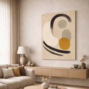 Modern living room with a beige sofa, wooden coffee table, and abstract art on the wall.